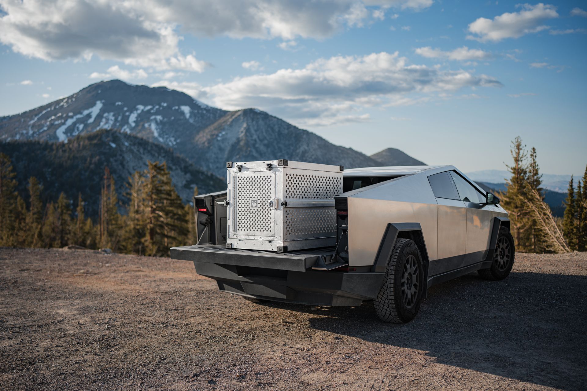 A real Tesla Cybertruck parked in a mountain landscape